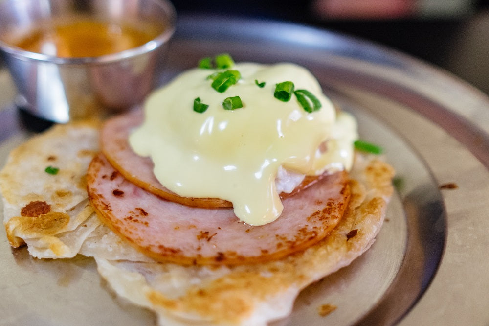 Chives sprinkled over eggs.