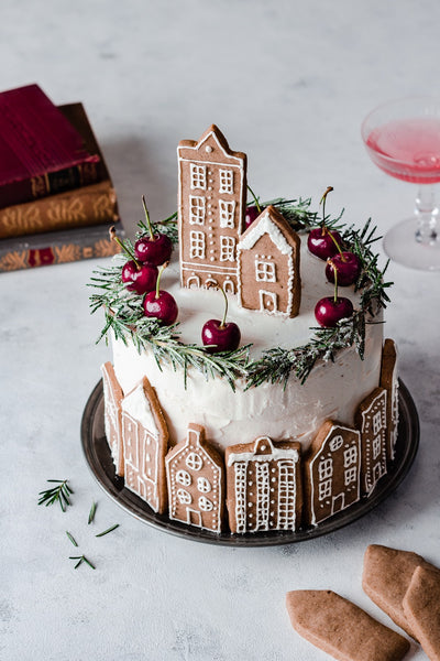 Christmas cake decorated with a rosemary wreath.