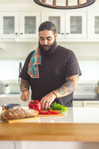 Man preparing a meal in a kitchen.