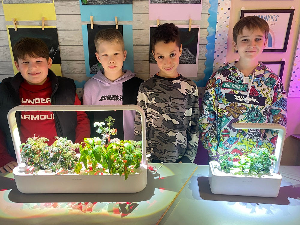 Students standing behind the Smart Garden 9.