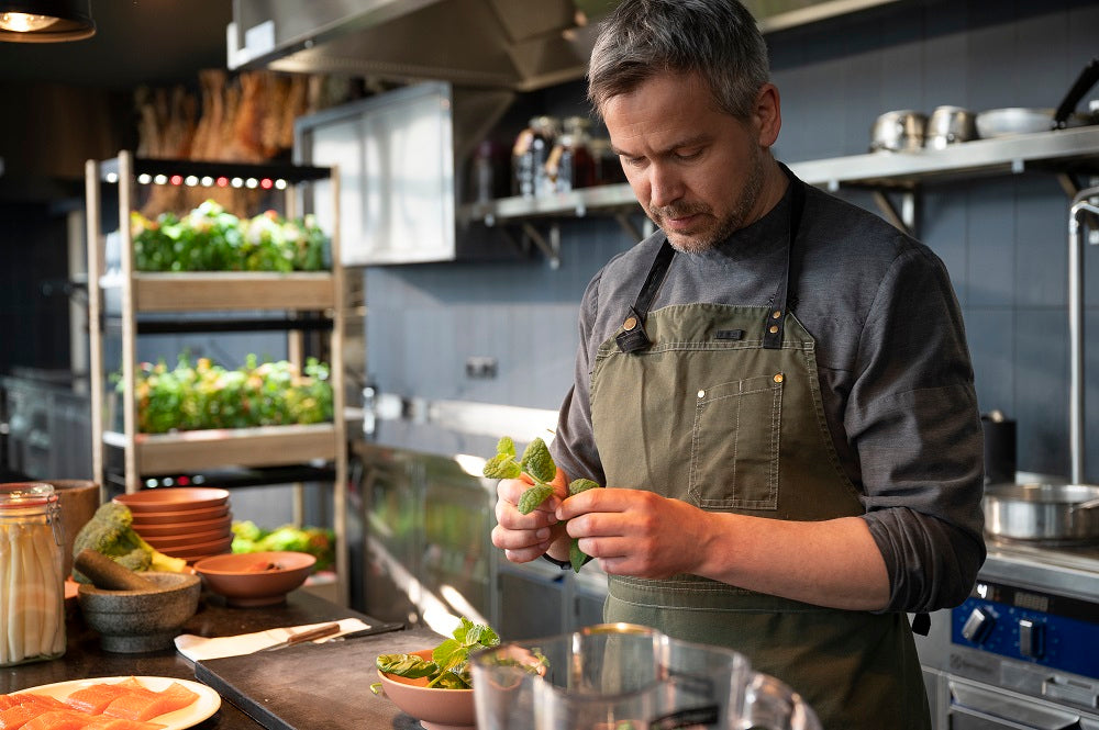 Man preparing a meal using greens grown in the Click & Grow 25.